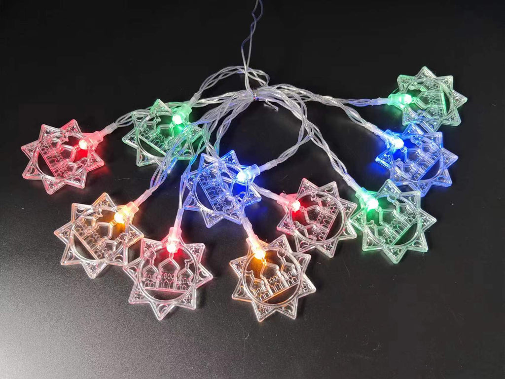 String lights with star-shaped bulbs on a black background