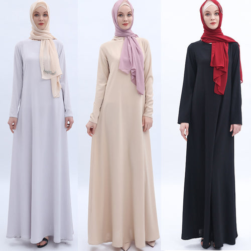 Three women wearing long dresses with hijabs in white, beige, and black on a white background.