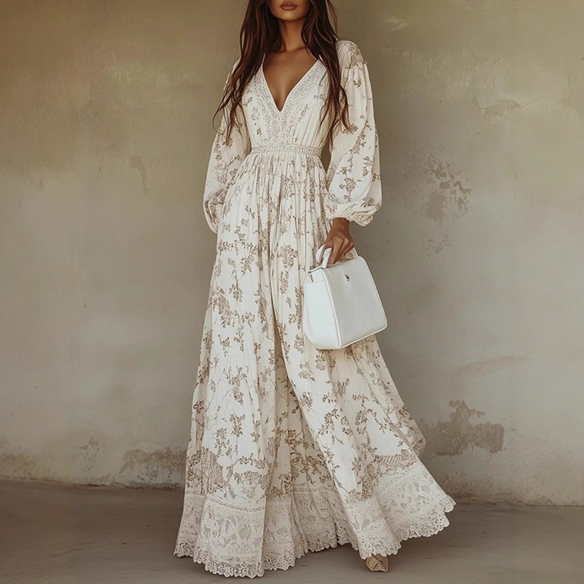 Woman wearing a floral dress holding a white handbag against a textured wall.