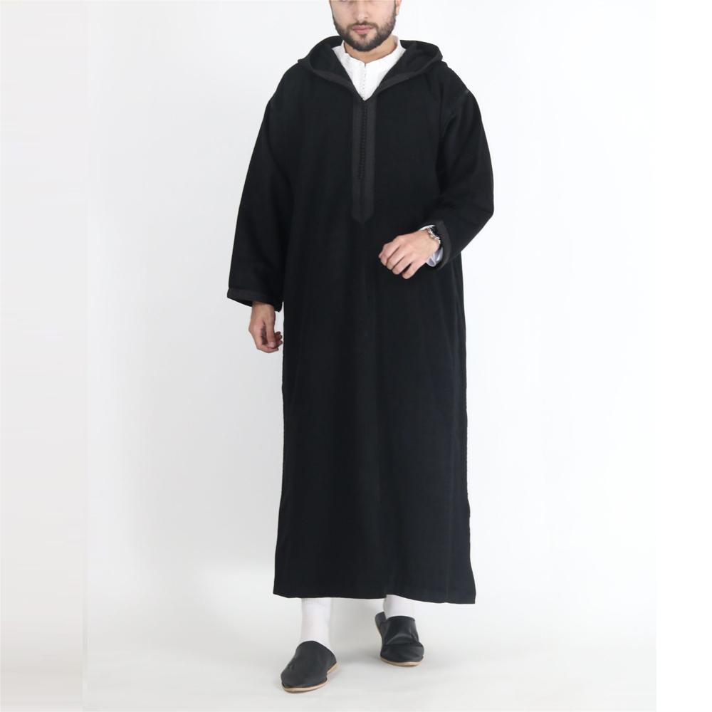 Person wearing a black abaya on a white background