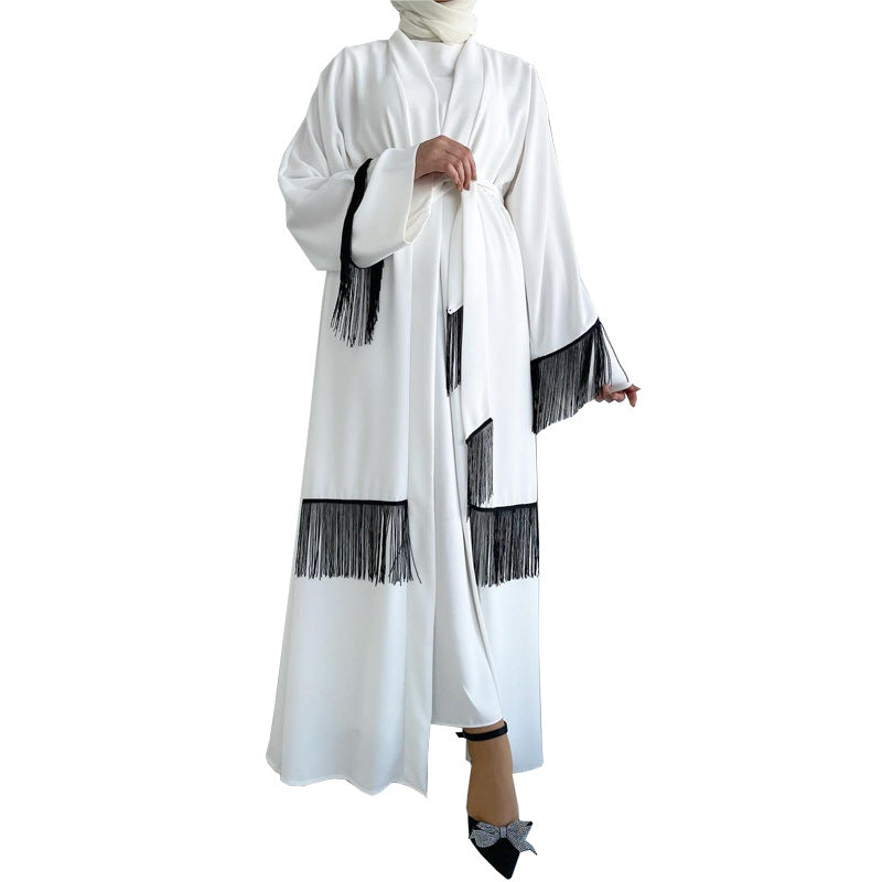 White abaya with black fringes on a white background