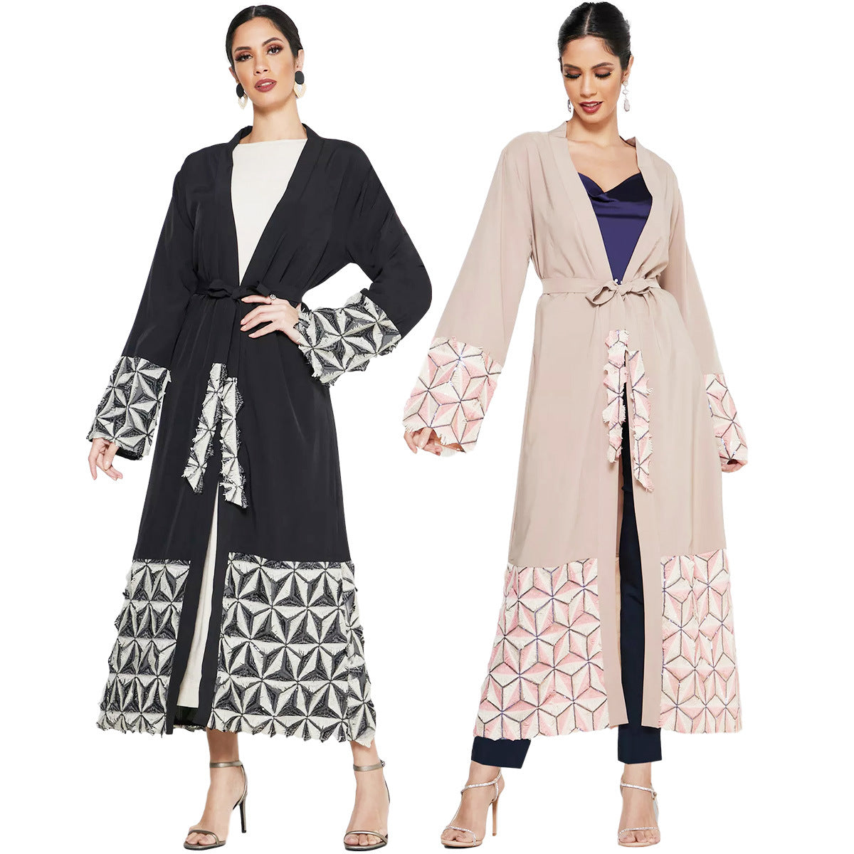 Two women wearing long, patterned jackets on a white background