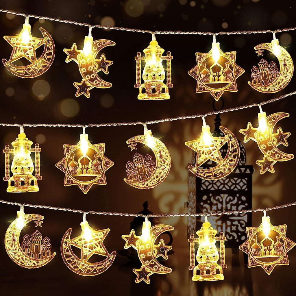 Decorative string lights with moon, star, and lantern designs on a dark background.