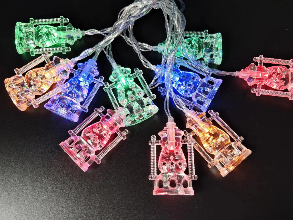 String lights with colorful lantern-shaped bulbs on a black background