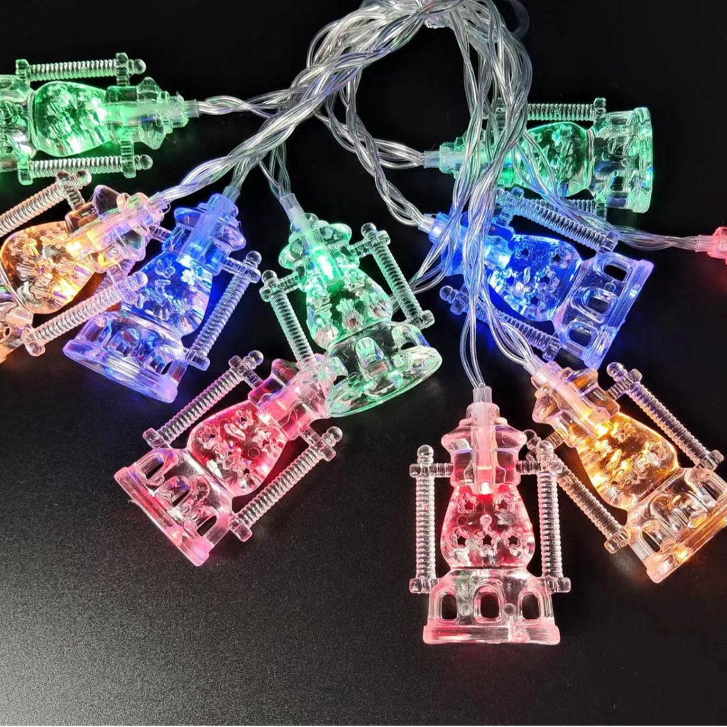 String lights with colorful lantern-shaped bulbs on a black background