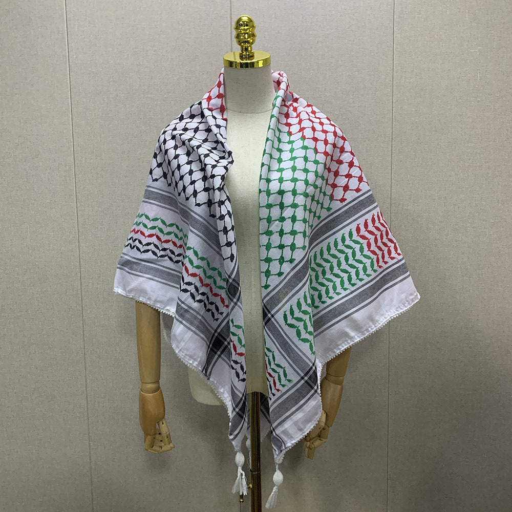 Mannequin wearing two patterned scarves against a plain background